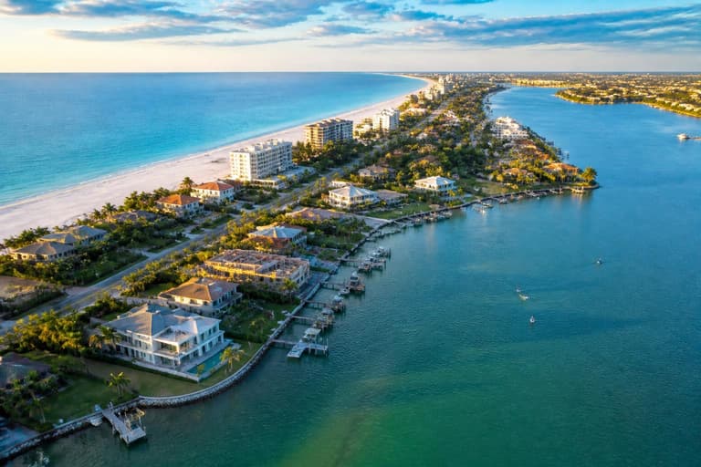Aerial of Siesta Key Sarasota waterfront with turquoise Gulf water and luxury homes